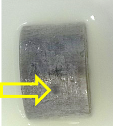 A convex portion of aluminium rod was measured by ic-SECM. The arrow indicates a blemish on the surface which affects the measurement.